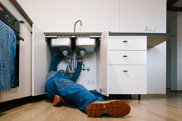 Professional Drain Cleaning technician working in Hartland, MI
